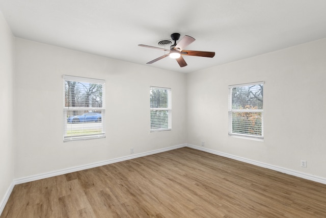 spare room with ceiling fan and light hardwood / wood-style flooring