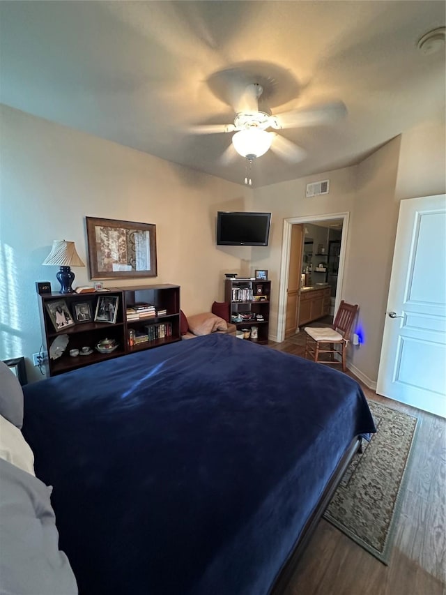 bedroom featuring ceiling fan and wood-type flooring