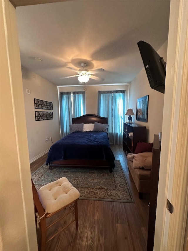 bedroom featuring hardwood / wood-style floors and ceiling fan