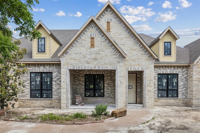 871 Beechwood Ln, Fairview, TX 75069 - view of front facade featuring stone siding, brick siding, and roof with shingles