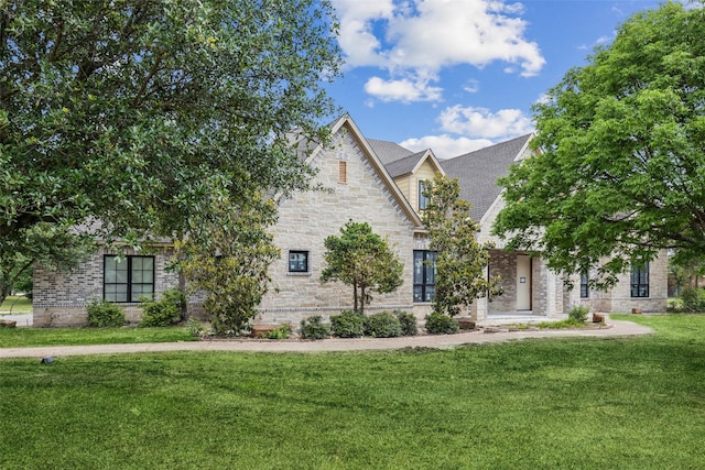871 Beechwood Ln, Fairview, TX 75069 - view of front facade with brick siding, stone siding, and a front yard