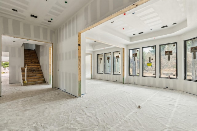 871 Beechwood Ln, Fairview, TX 75069 - spare room featuring stairway and a tray ceiling
