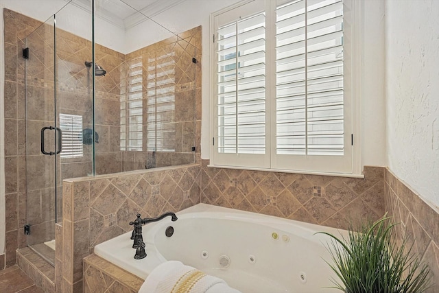 bathroom featuring a shower stall, a wealth of natural light, a whirlpool tub, and ornamental molding