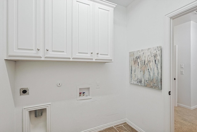 laundry area with hookup for a washing machine, baseboards, hookup for an electric dryer, cabinet space, and hookup for a gas dryer