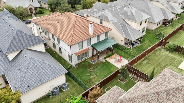 birds eye view of property with a residential view