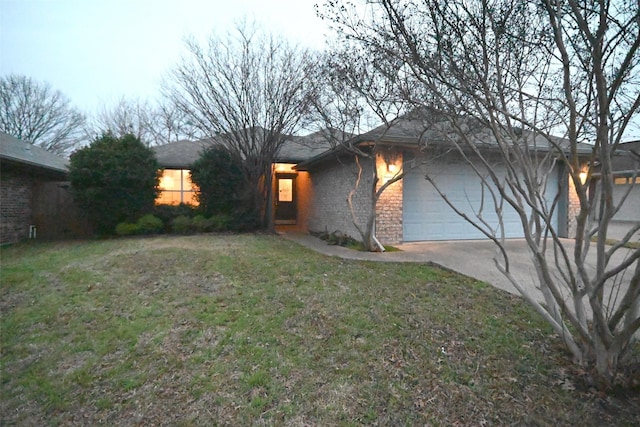 view of front of property with a garage and a front yard