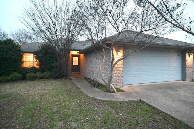 view of front of home with a garage and a front lawn