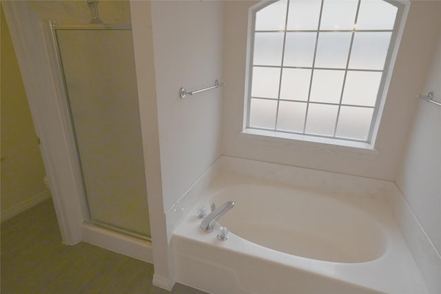 bathroom with separate shower and tub