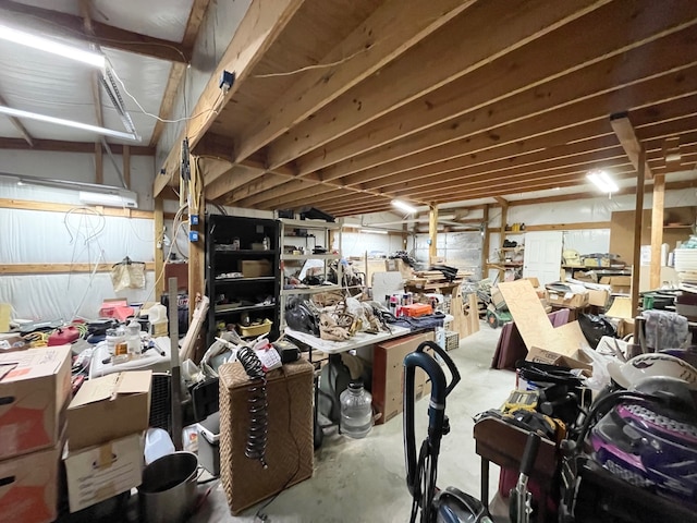 misc room with concrete floors and a workshop area