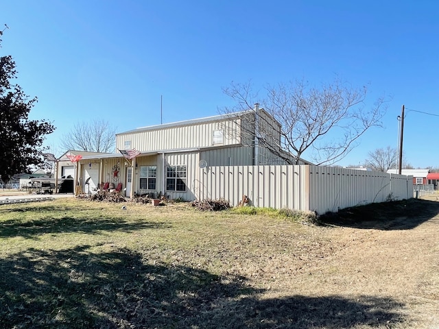 view of side of property with a yard