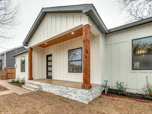 rear view of house with a porch