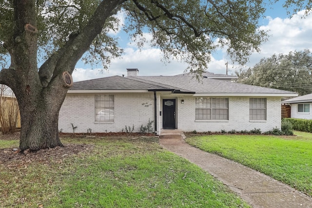 ranch-style home featuring a front yard