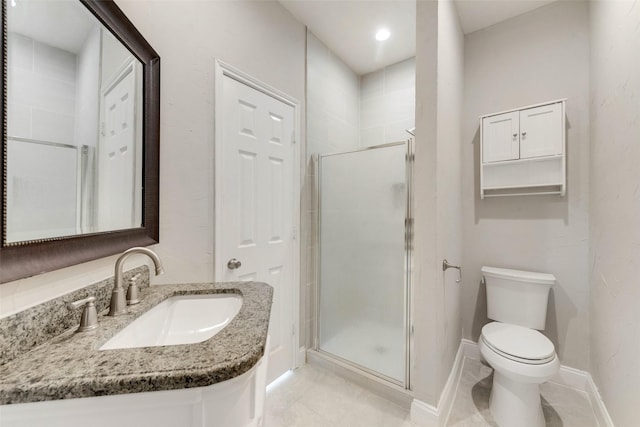 bathroom featuring an enclosed shower, vanity, tile patterned flooring, and toilet