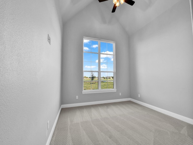 unfurnished room with ceiling fan, lofted ceiling, and carpet floors