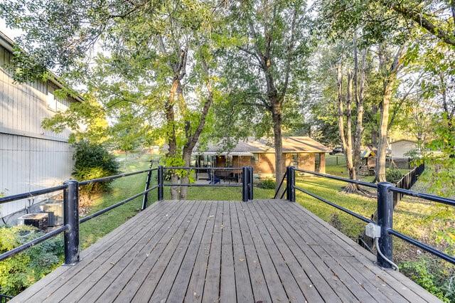 wooden deck with a yard