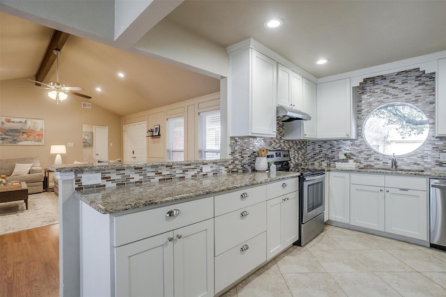 kitchen with sink, stainless steel appliances, white cabinets, stone countertops, and kitchen peninsula