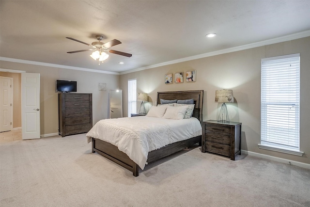 carpeted bedroom with ornamental molding and ceiling fan