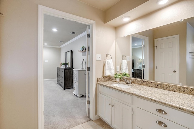 bathroom with vanity and ornamental molding