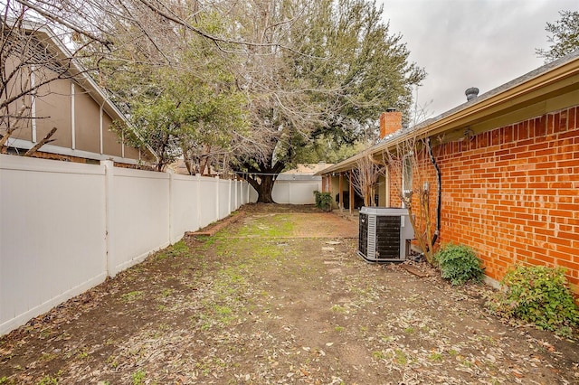 view of yard featuring central AC unit