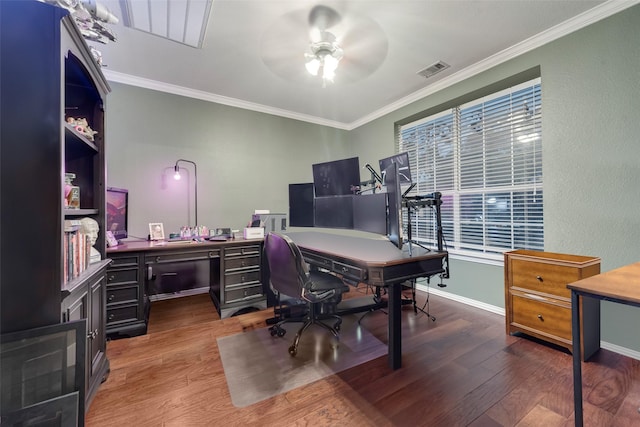 home office featuring dark hardwood / wood-style flooring, ornamental molding, and ceiling fan