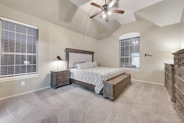 bedroom with lofted ceiling, light colored carpet, and ceiling fan