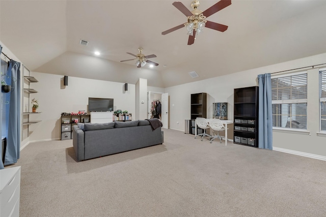 living room with vaulted ceiling and light colored carpet