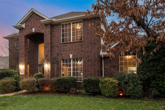 front facade with a lawn