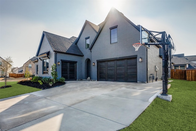 view of home's exterior with a garage and a yard