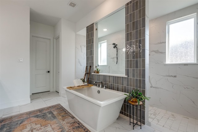 bathroom with tile walls and plus walk in shower