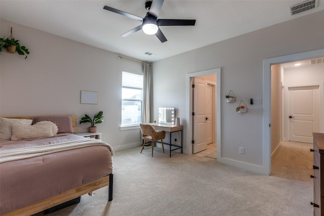 bedroom with light carpet and ceiling fan