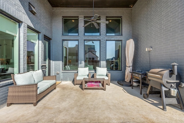 view of patio with an outdoor living space, ceiling fan, and grilling area