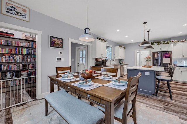 dining space with light hardwood / wood-style floors