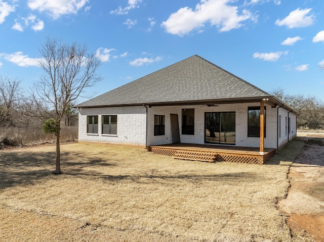 back of property with a lawn