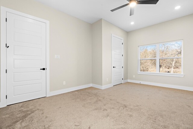 unfurnished bedroom with ceiling fan and carpet floors