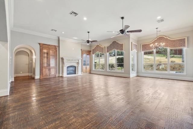 unfurnished living room with ceiling fan with notable chandelier, plenty of natural light, ornamental molding, and dark hardwood / wood-style floors