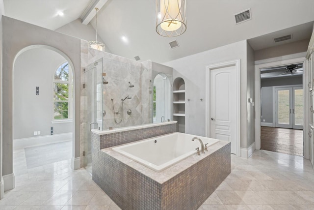 bathroom with french doors, shower with separate bathtub, and vaulted ceiling with beams