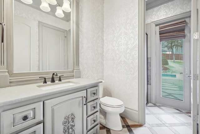 bathroom featuring vanity and toilet