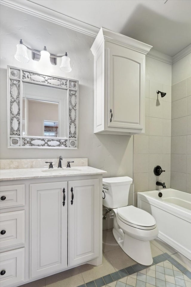 full bathroom featuring tile patterned flooring, vanity, ornamental molding, tiled shower / bath, and toilet