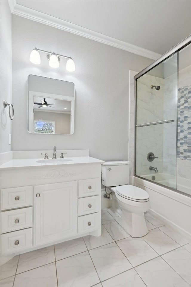 full bathroom with crown molding, toilet, vanity, and bath / shower combo with glass door