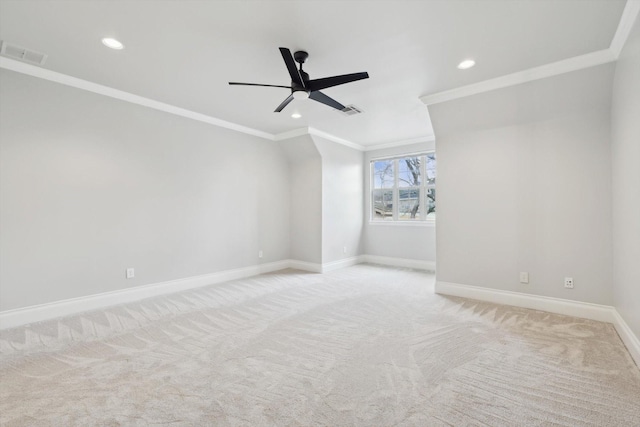 carpeted empty room featuring crown molding and ceiling fan