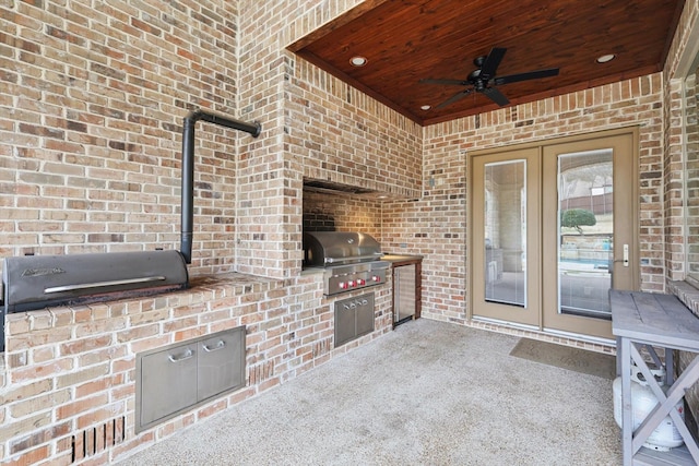 view of patio / terrace featuring ceiling fan, grilling area, and exterior kitchen