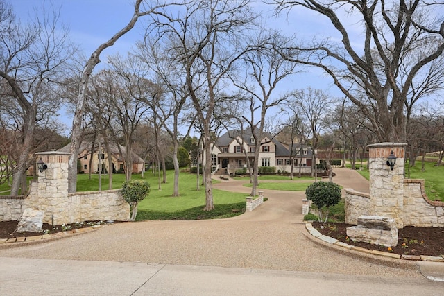 view of property's community with a lawn