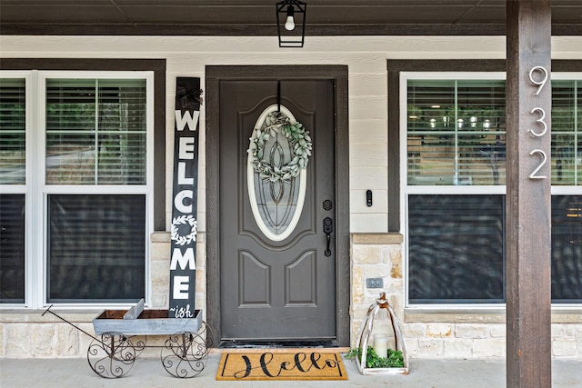 932 Devils River Dr, Granbury, TX 76048 - view of exterior entry with a porch and stone siding
