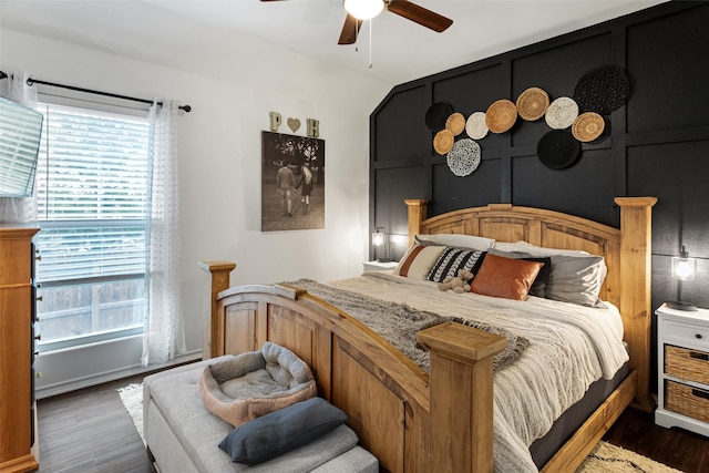 bedroom featuring ceiling fan and dark hardwood / wood-style floors