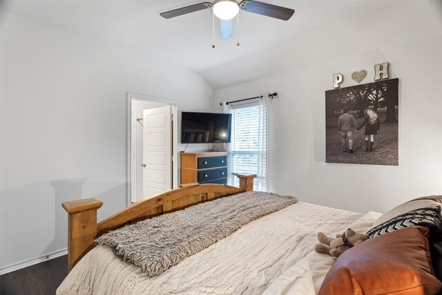 bedroom with ceiling fan, lofted ceiling, and dark hardwood / wood-style flooring