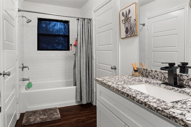 bathroom with shower / tub combo with curtain, vanity, and hardwood / wood-style floors