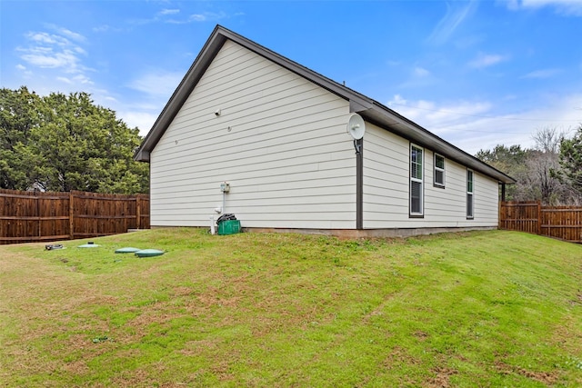 view of property exterior with a lawn