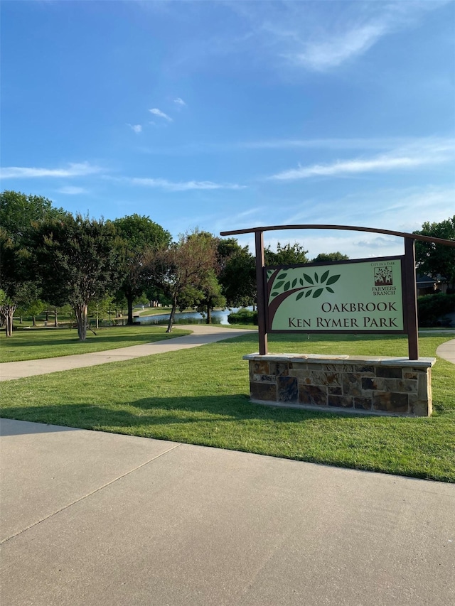 view of home's community with a yard