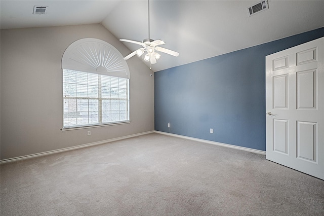 unfurnished room featuring lofted ceiling, light carpet, and ceiling fan