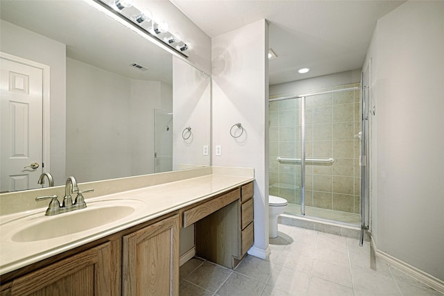 bathroom with tile patterned floors, vanity, toilet, and an enclosed shower